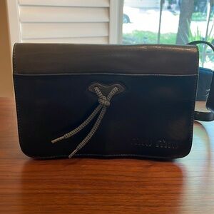 Miu Miu black and olive shoulder bag with Velcro opening and shoelace tie